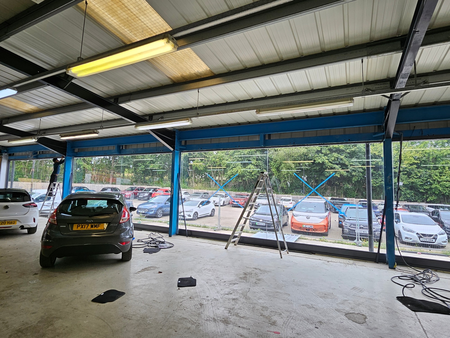 Completed commercial aluminium curtain wall installation at a car dealership